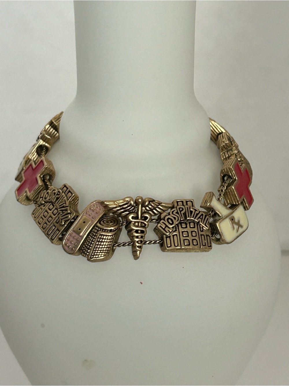 Medical-Themed Gold Tone Charm Bracelet with Pink Red Accents[6)